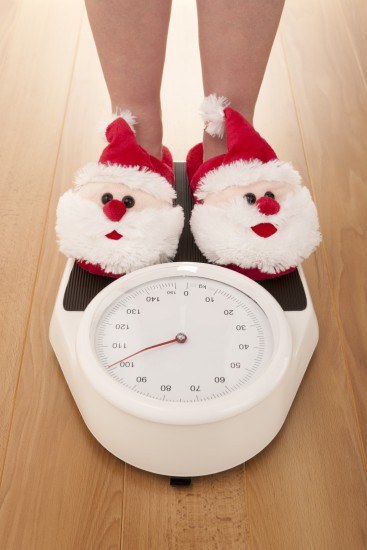 Santa Claus slippers on weight scales