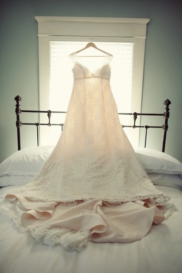 hanging-wedding-dress-over-bed