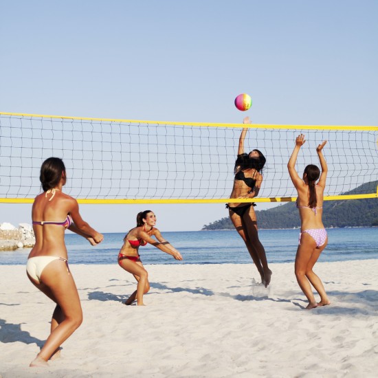 Group of people playing beach volleyball