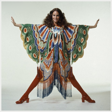 lesley-ann-warren-wearing-colorful-butterfly-wing-kimono-with-fringe-at-hem-by-adolfo-with-red-tights-and-sandals-1971