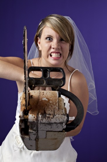 angry young bride with an chainsaw on a dark blue background