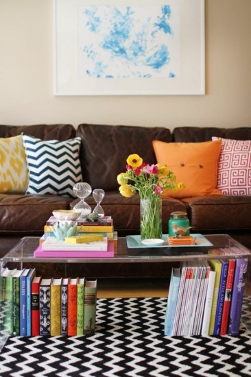 books under a clear coffee table