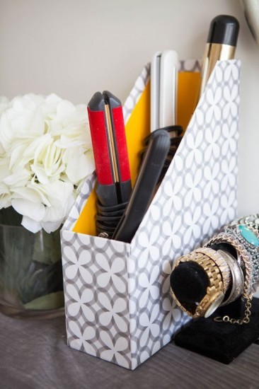 curling iron in a decorative magazine holder