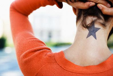 Woman Showing Her Star Tattoo