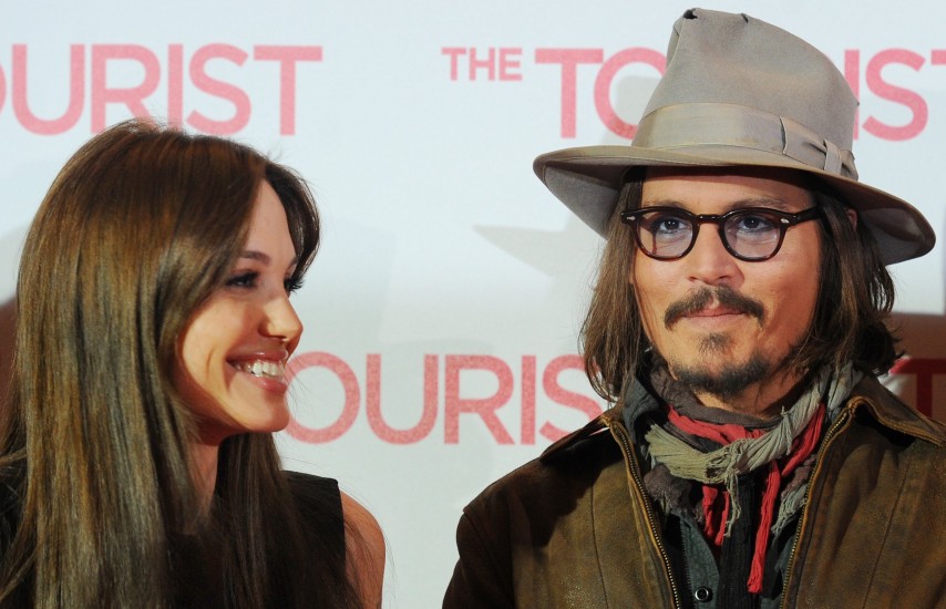 US actors Angelina Jolie (L) and Johnny Depp (R) attend the photocall for the German premiere of their new film 'The Tourist' at Adlon hotel in Berlin, Germany, 14 December, 2010. 'The Tourist' will be in Germany from 16 December on. Photo by Jens Kalaene/DPA/ABACAPRESS.COM