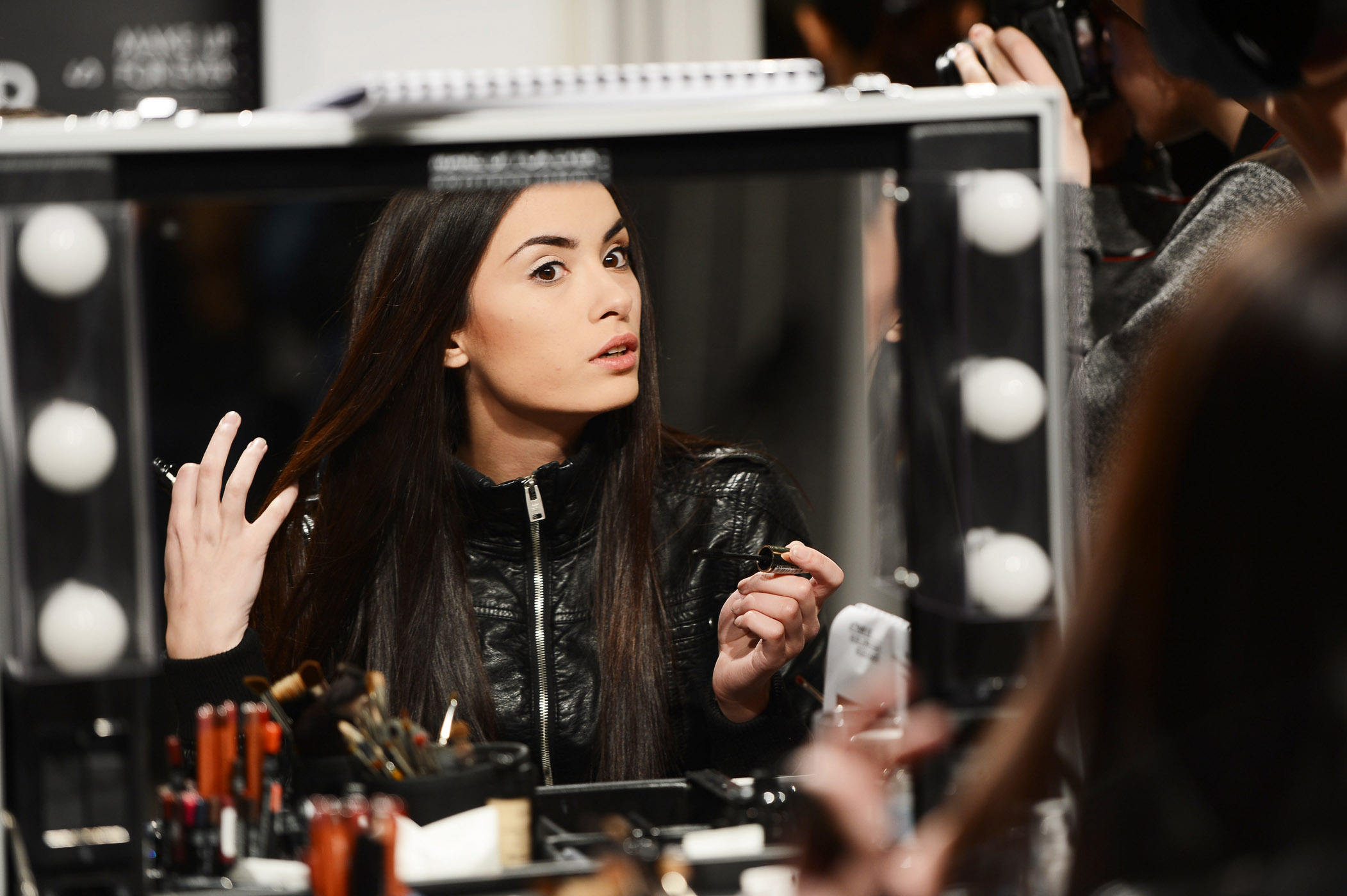 MOSCOW, RUSSIA - MARCH 30:  A model prepares backstage at the Olga Brovkina show during Mercedes-Benz Fashion Week Russia Fall/Winter 2013/2014 at Manege on March 30, 2013 in Moscow, Russia.  (Photo by Ian Gavan/Getty Images for MBFW Russia)