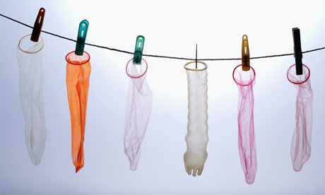 Colourful condoms hanging on a string