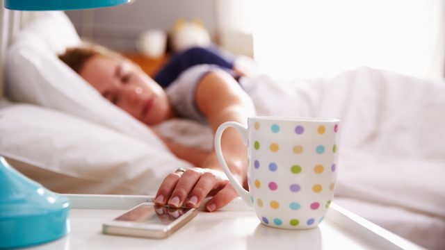 Sleeping Couple Being Woken By Mobile Phone In Bedroom; Shutterstock ID 265632770; PO: today.com