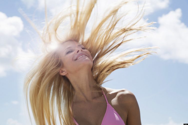 Smiling woman tossing her hair